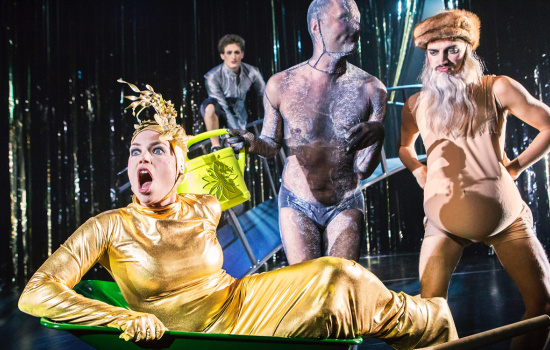 performer in gold clothes on a stage